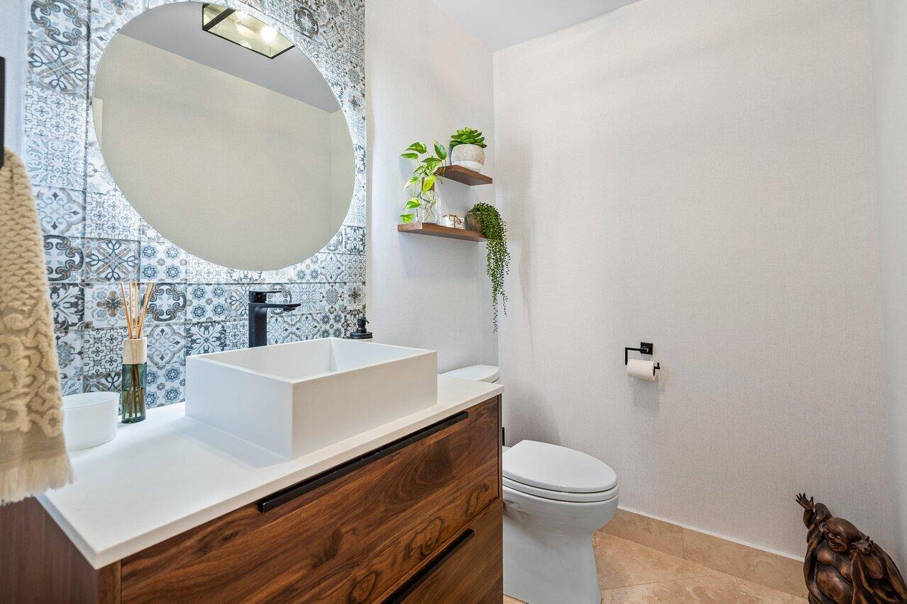 3765 Kings Way Boca Raton, FL 33434 - Photo 25 of 60 a bathroom with a sink mirror vanity and toilet
