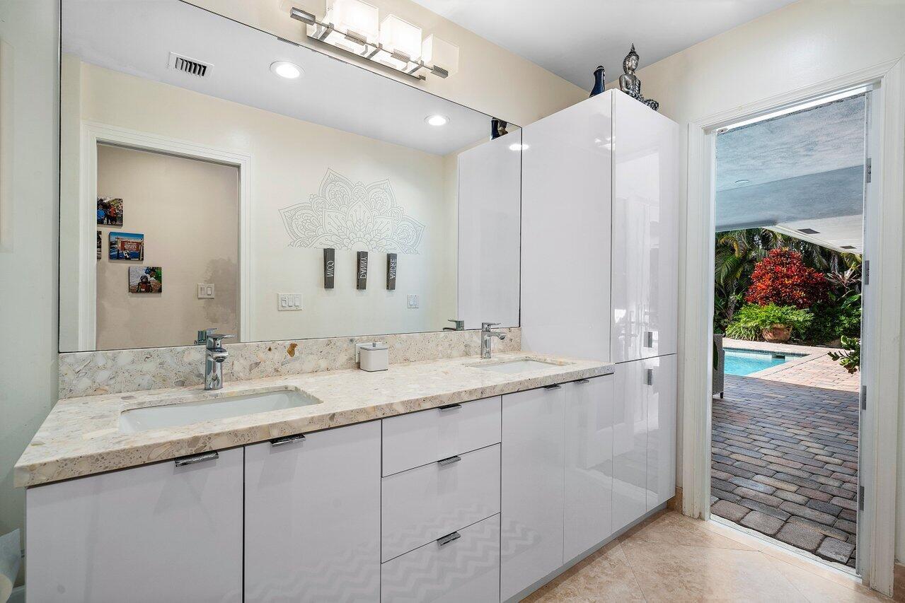 3765 Kings Way Boca Raton, FL 33434 - Photo 28 of 60 a bathroom with a double vanity sink and mirror