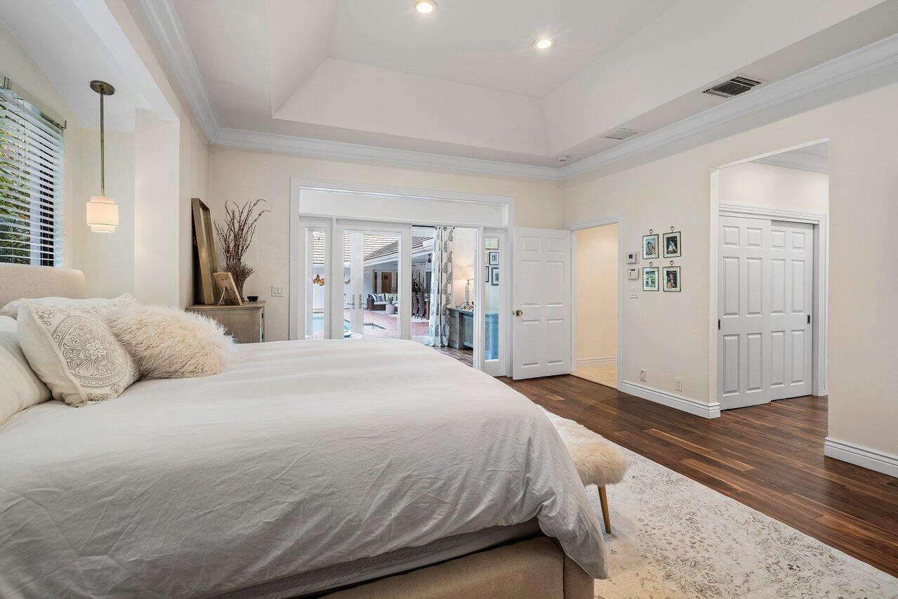 3765 Kings Way Boca Raton, FL 33434 - Photo 33 of 60 a spacious bedroom with a bed and a walk in closet