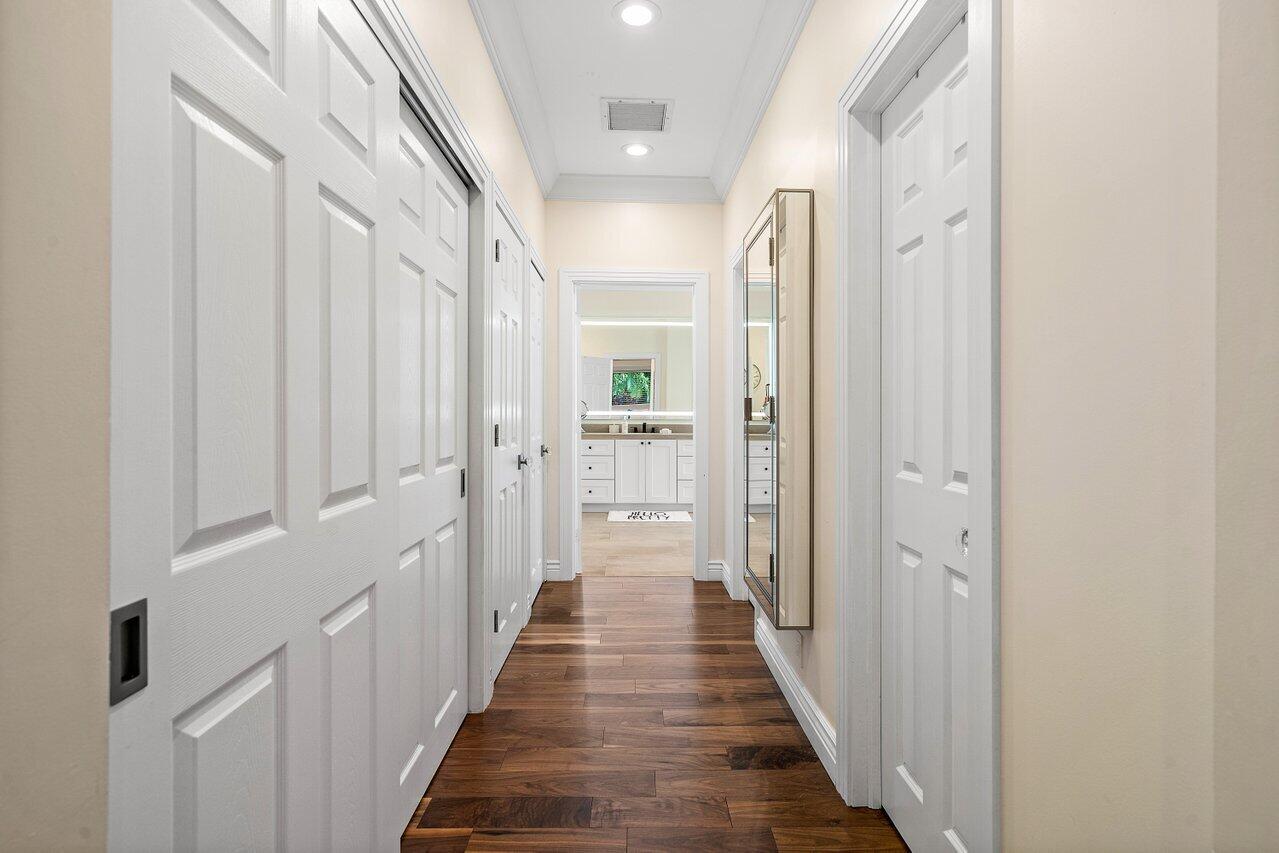 3765 Kings Way Boca Raton, FL 33434 - Photo 36 of 60 a view of a hallway with wooden floor and closet area