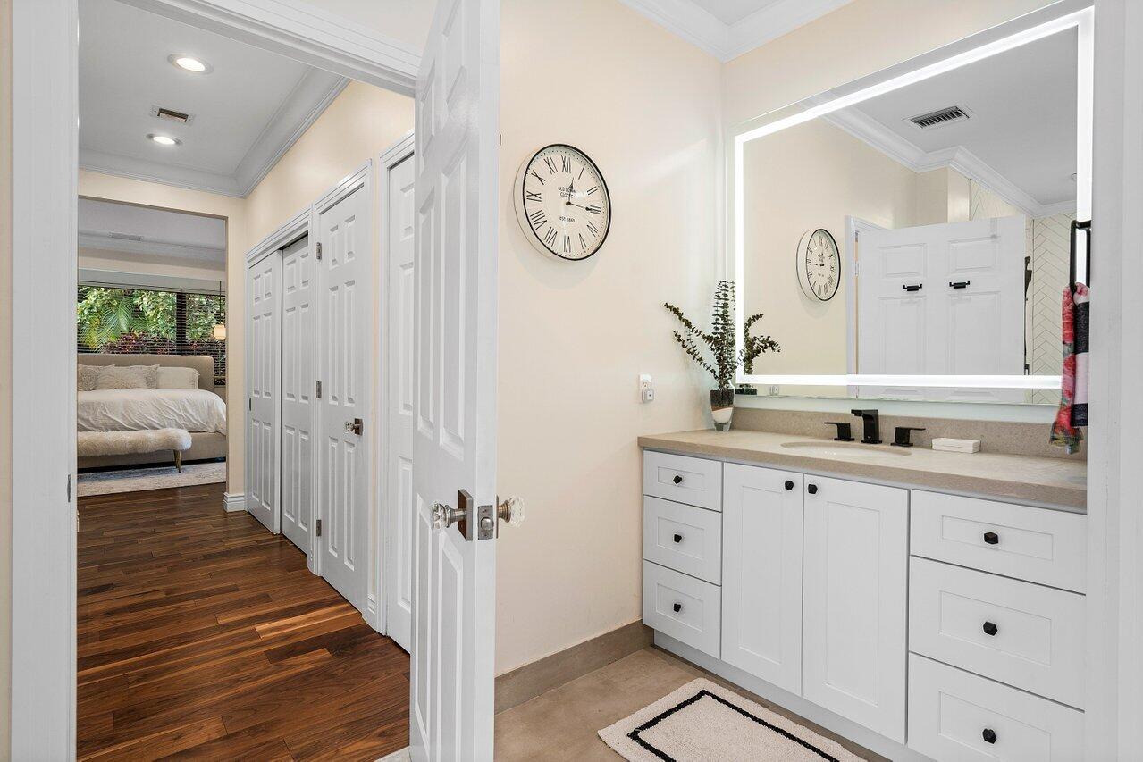 3765 Kings Way Boca Raton, FL 33434 - Photo 39 of 60 a spacious bathroom with a double vanity sink and a mirror