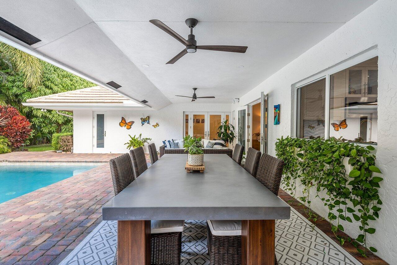 3765 Kings Way Boca Raton, FL 33434 - Photo 40 of 60 a view of a dining room with furniture window and wooden floor