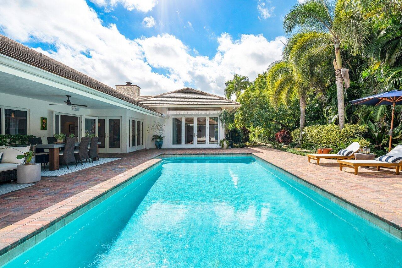 3765 Kings Way Boca Raton, FL 33434 - Photo 46 of 60 a view of a house with swimming pool and sitting area