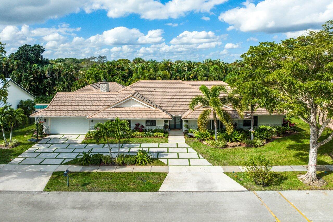 3765 Kings Way Boca Raton, FL 33434 - Photo 47 of 60 a view of a house with a big yard plants and large tree