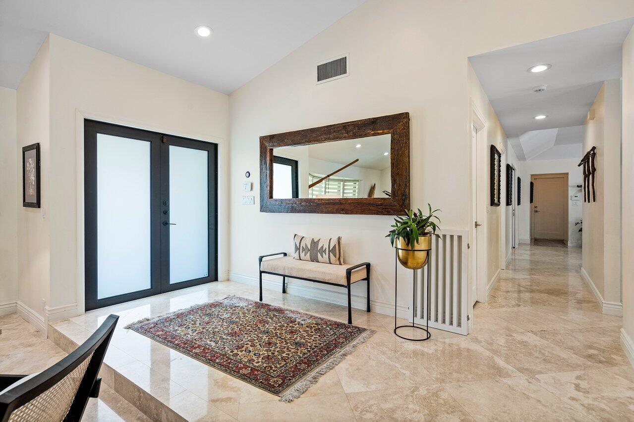 3765 Kings Way Boca Raton, FL 33434 - Photo 5 of 60 a living room with a rug and a table
