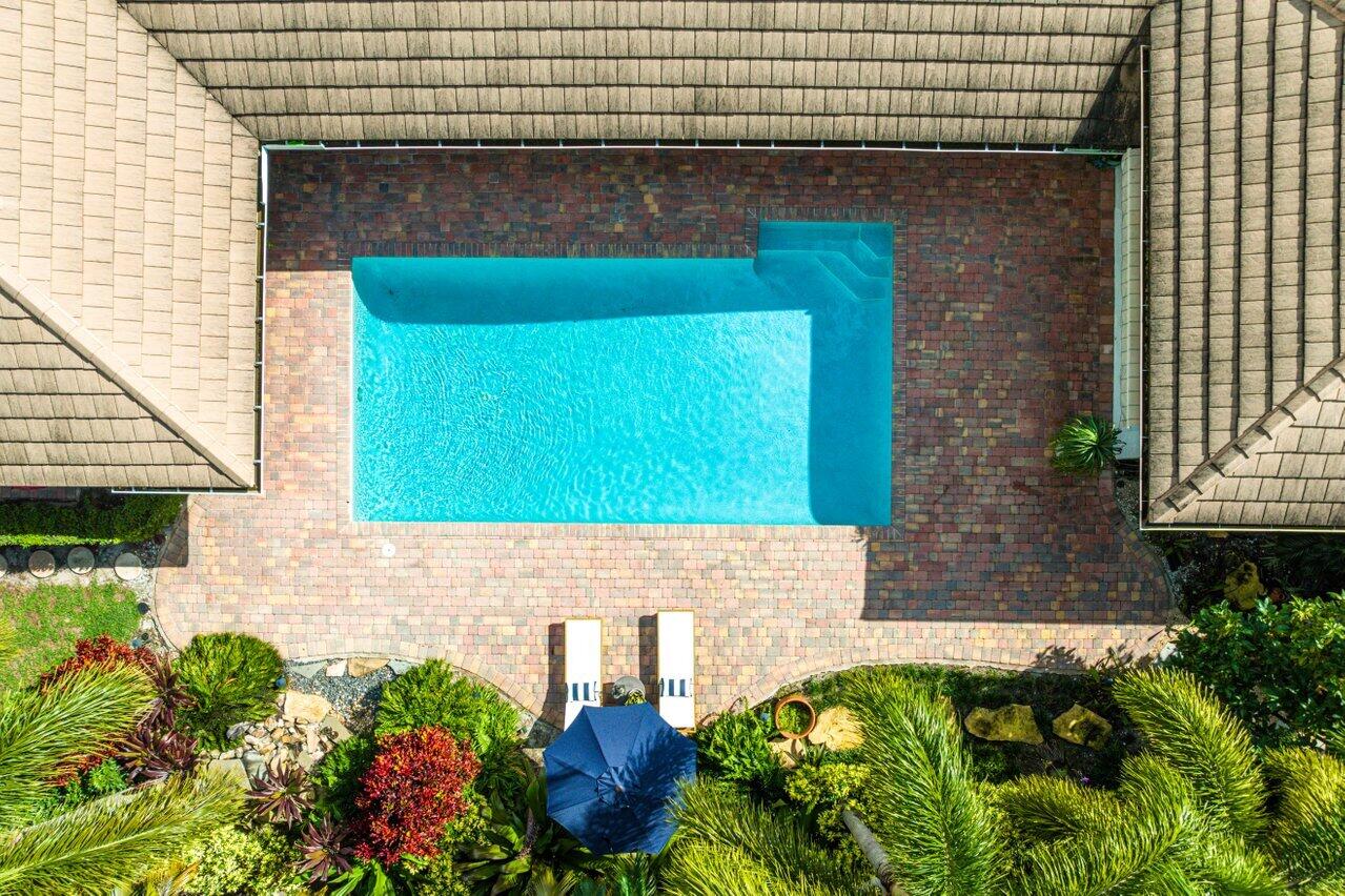 3765 Kings Way Boca Raton, FL 33434 - Photo 51 of 60 a brick building with a potted plant