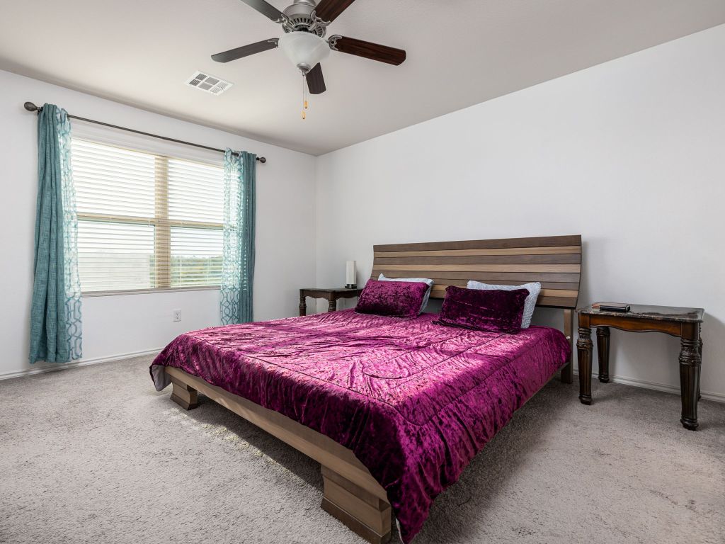 464 Druse Lane Jarrell, TX 76537 - Photo 13 of 26 a bedroom with a bed and window