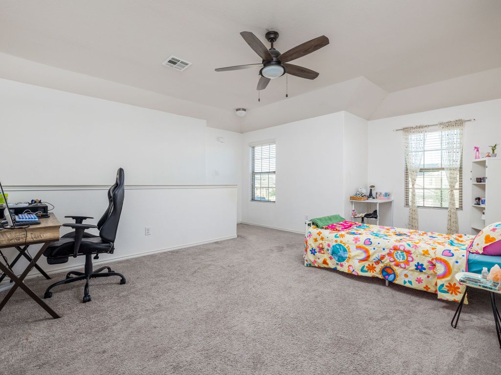 464 Druse Lane Jarrell, TX 76537 - Photo 16 of 26 a bedroom with furniture and a window