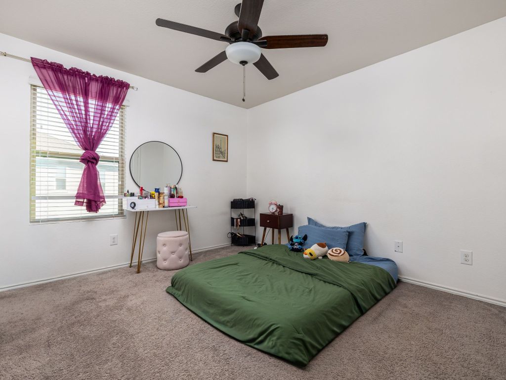 464 Druse Lane Jarrell, TX 76537 - Photo 19 of 26 a bedroom with a bed dresser and a window