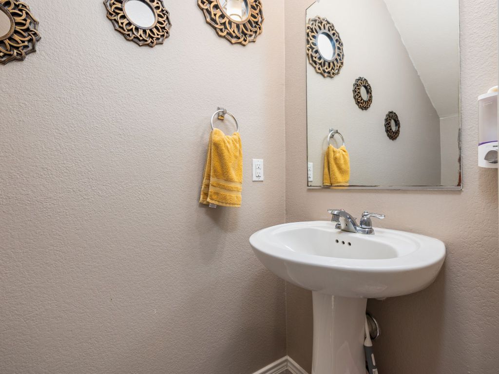 464 Druse Lane Jarrell, TX 76537 - Photo 20 of 26 a bathroom with a sink and a mirror