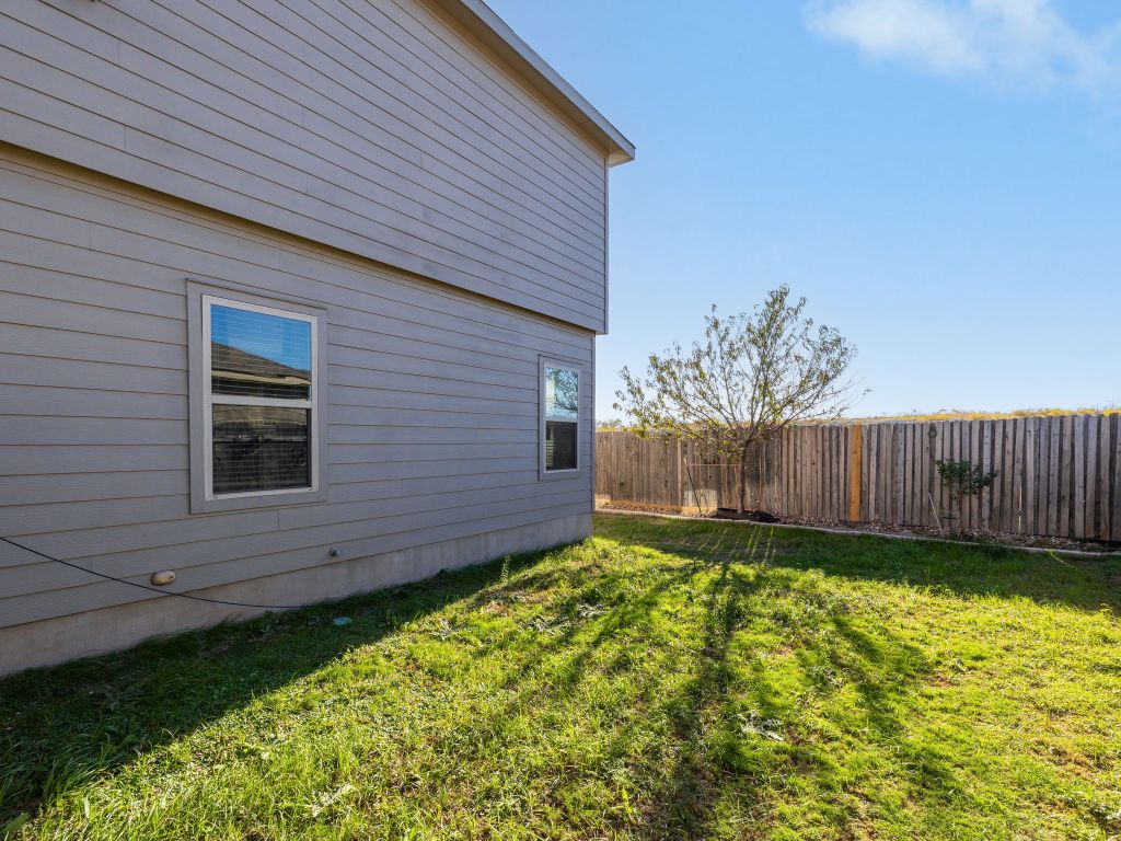 464 Druse Lane Jarrell, TX 76537 - Photo 24 of 26 a view of a backyard with a garden