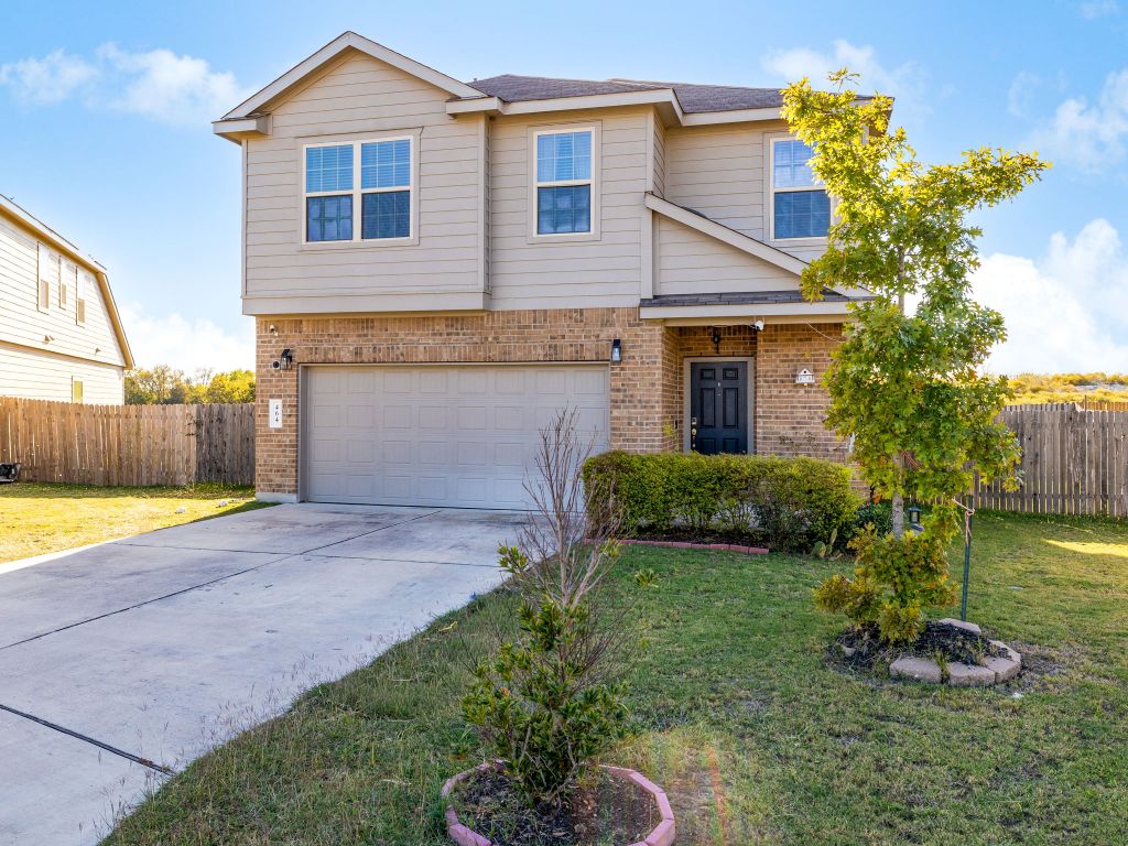 464 Druse Lane Jarrell, TX 76537 - Photo 3 of 26 a front view of a house with garden
