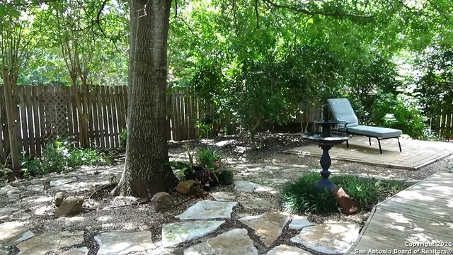 a view of a bench in a garden