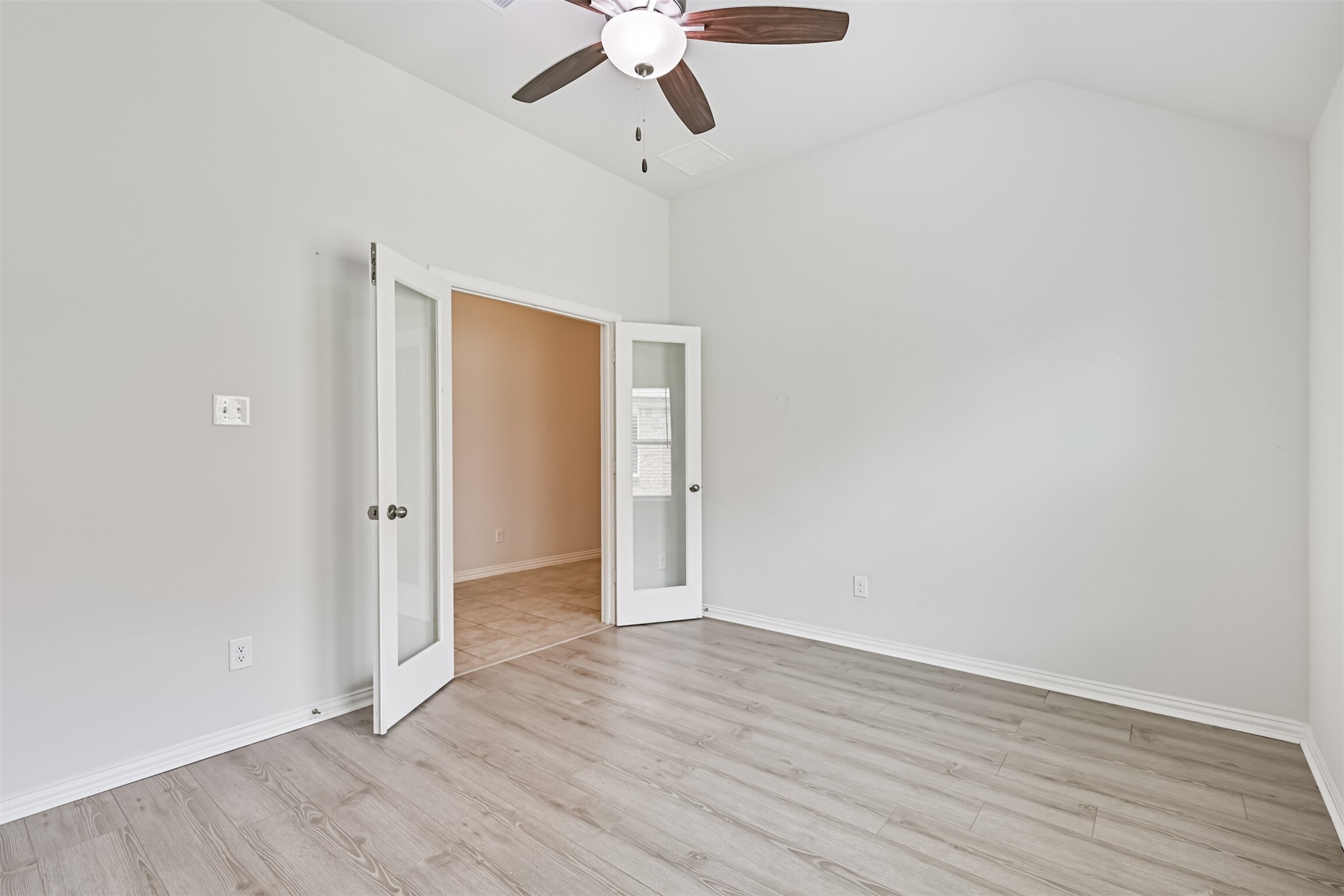 7019 Terra Drive Manvel, TX 77578 - Photo 8 of 41 a view of an empty room with wooden floor