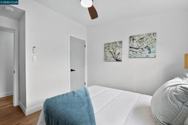 a bedroom with a bed and bathroom