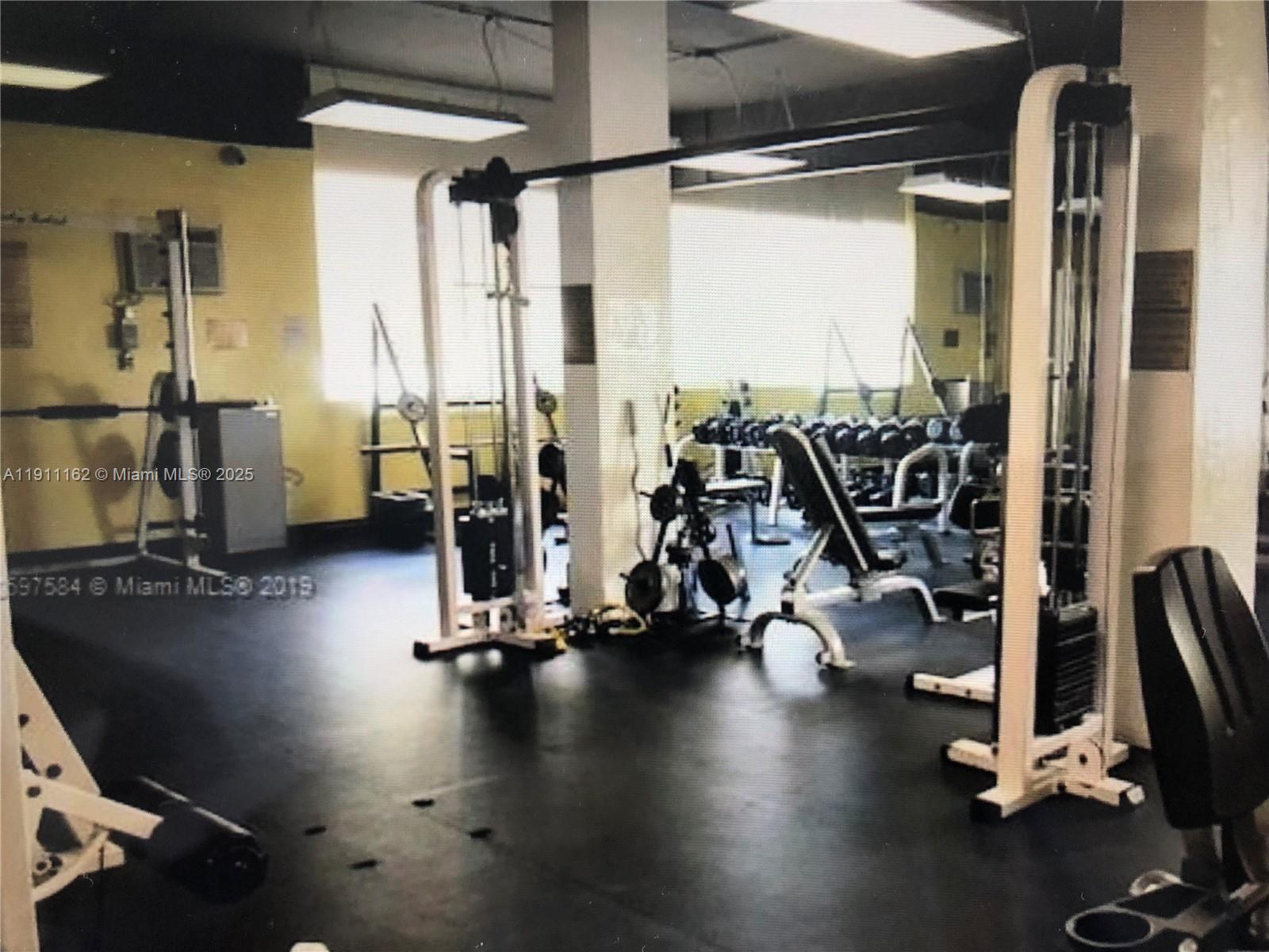 150 Southeast 25th Road, Unit 4C Miami, FL 33129 - Photo 16 of 23 a view of a room with gym equipment