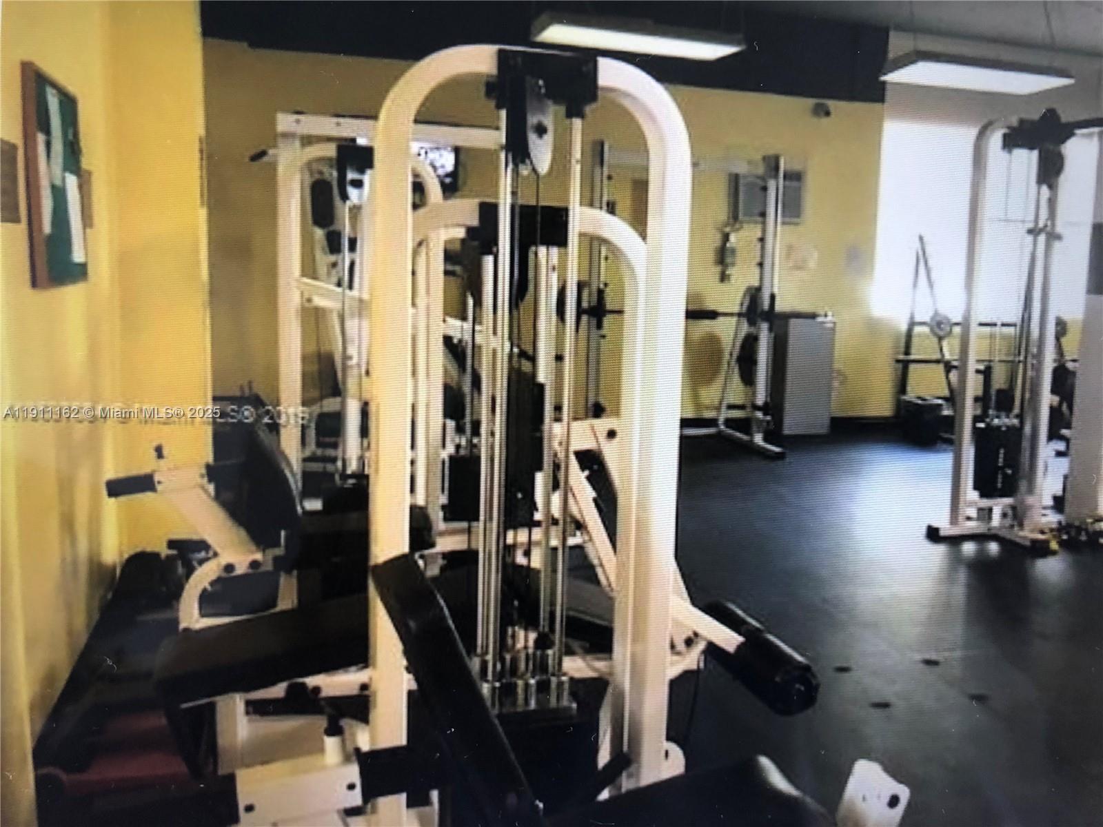 150 Southeast 25th Road, Unit 4C Miami, FL 33129 - Photo 17 of 23 a view of a room with gym equipment
