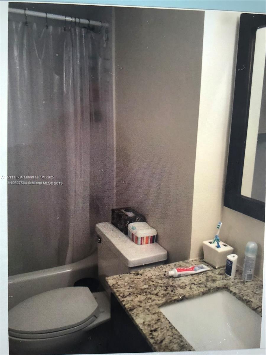 150 Southeast 25th Road, Unit 4C Miami, FL 33129 - Photo 6 of 23 a bathroom with a sink toilet and shower