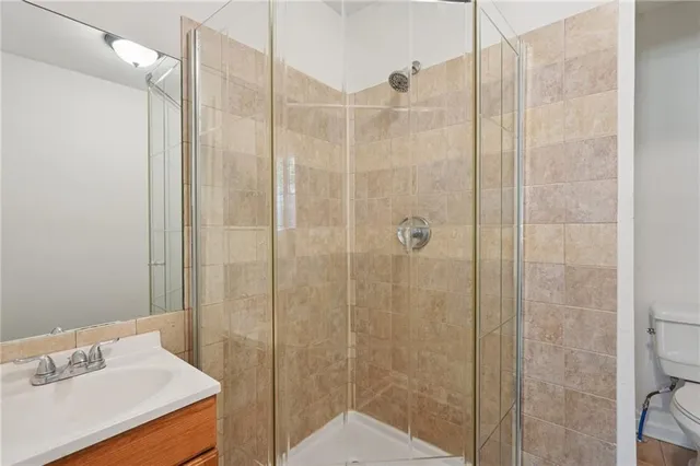 a bathroom with a shower and a sink