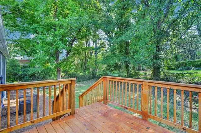 a view of balcony with deck and trees