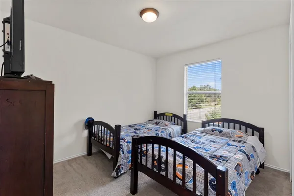 a view of room with window and ceiling fan