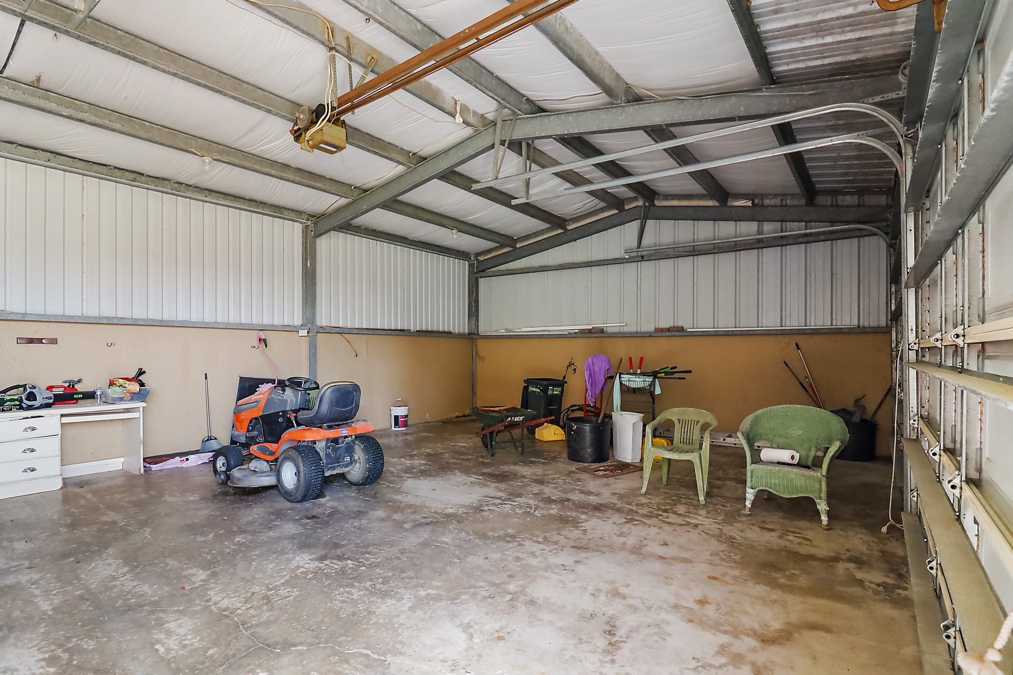 405 Park Street Anahuac, TX 77514 - Photo 6 of 37 The 3 car garage/shop has 3 bay access.