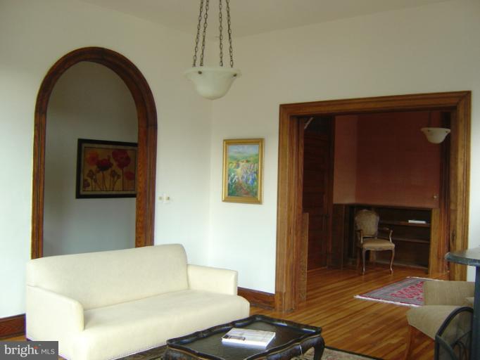258 8th Street Southeast Washington, DC 20003 - Photo 11 of 30 a living room with furniture and a wooden floor