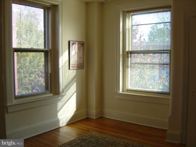 258 8th Street Southeast Washington, DC 20003 - Photo 14 of 30 a view of an empty room with wooden floor and a window