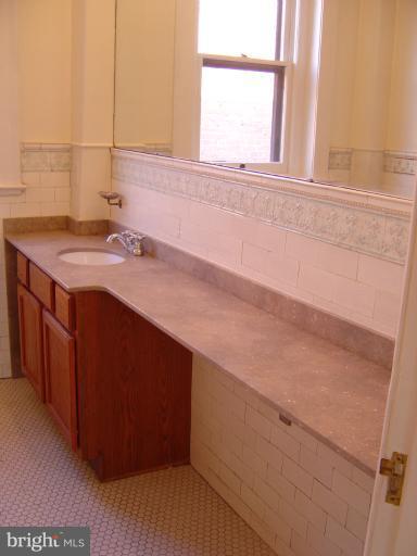 258 8th Street Southeast Washington, DC 20003 - Photo 15 of 30 a bathroom with a sink and a window