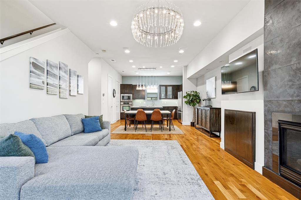 4618 Cedar Springs Road, Unit B Dallas, TX 75219 - Photo 1 of 24 a living room with furniture fireplace and kitchen view