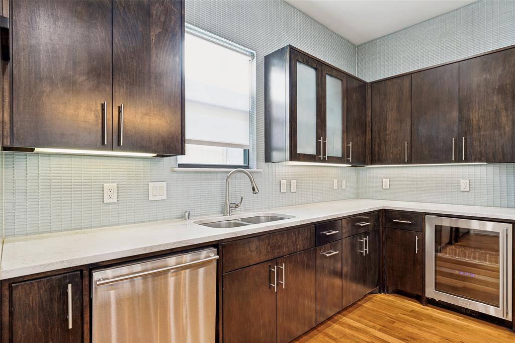 4618 Cedar Springs Road, Unit B Dallas, TX 75219 - Photo 12 of 24 a kitchen with a sink and cabinets