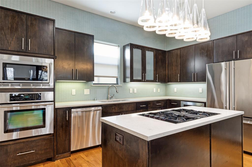 4618 Cedar Springs Road, Unit B Dallas, TX 75219 - Photo 13 of 24 a kitchen with a stove and a microwave