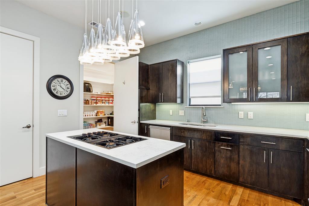 4618 Cedar Springs Road, Unit B Dallas, TX 75219 - Photo 14 of 24 a kitchen with a sink a stove and a window