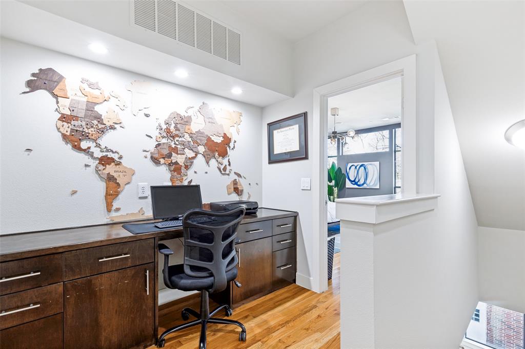 4618 Cedar Springs Road, Unit B Dallas, TX 75219 - Photo 17 of 24 a view of a workspace with furniture and a window