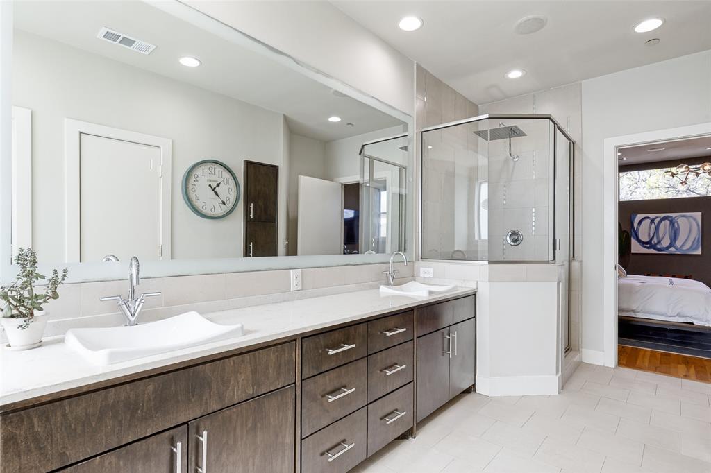 4618 Cedar Springs Road, Unit B Dallas, TX 75219 - Photo 22 of 24 a bathroom with a double vanity sink and a mirror