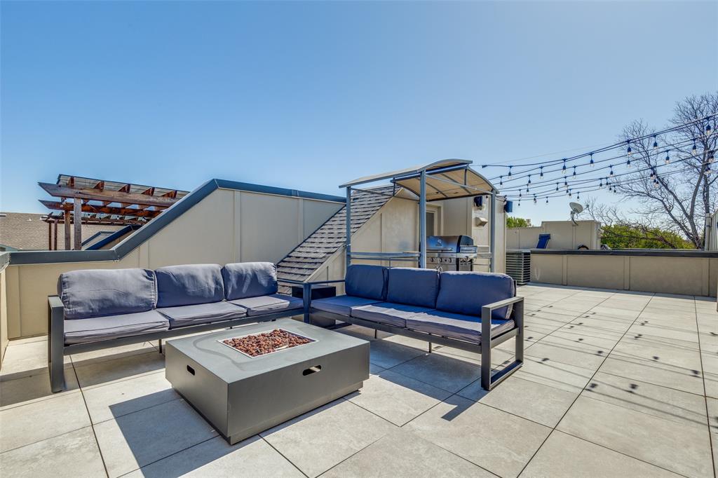 4618 Cedar Springs Road, Unit B Dallas, TX 75219 - Photo 24 of 24 a living room with furniture and a rug