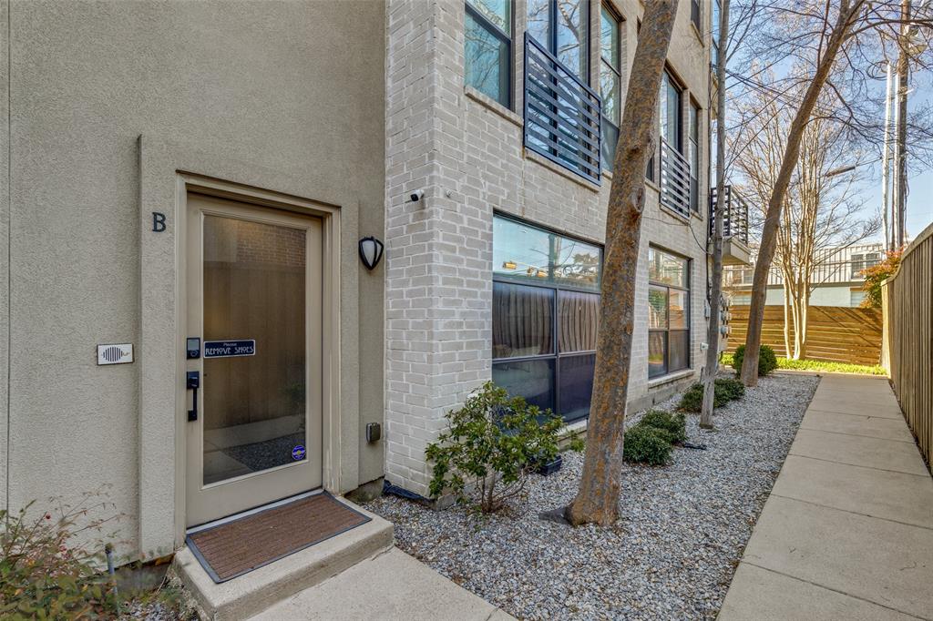 4618 Cedar Springs Road, Unit B Dallas, TX 75219 - Photo 3 of 24 a view of a brick house with a yard