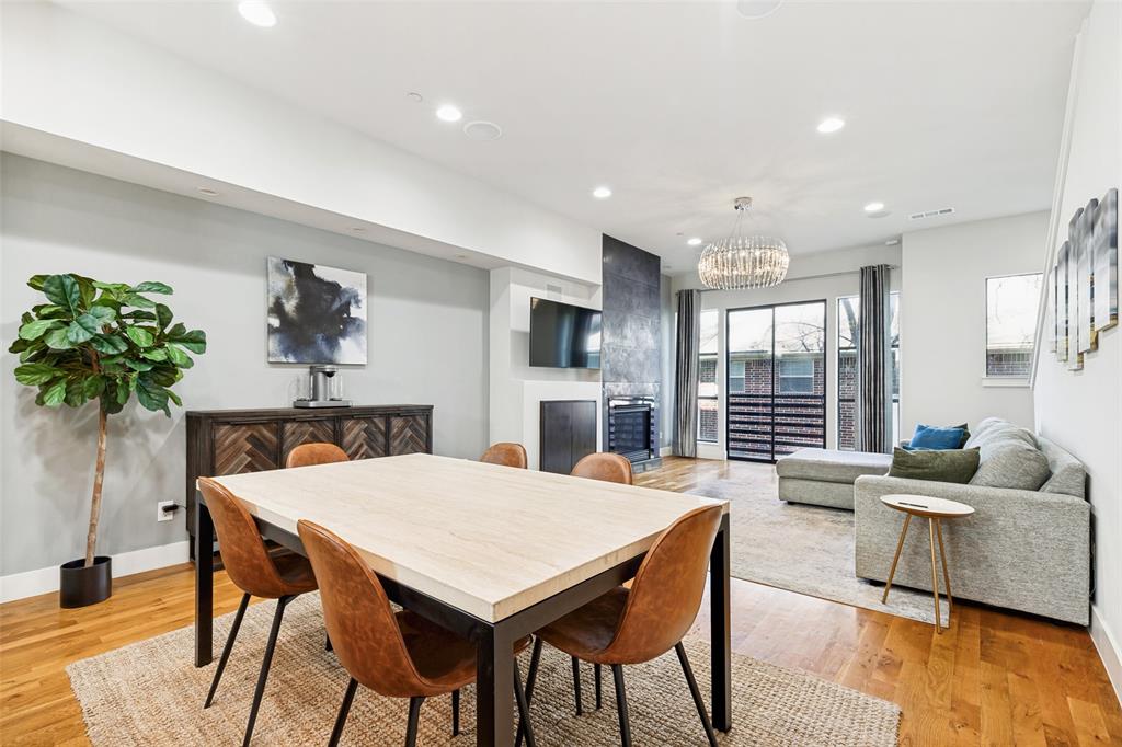 4618 Cedar Springs Road, Unit B Dallas, TX 75219 - Photo 6 of 24 a view of a dining room with furniture and wooden floor