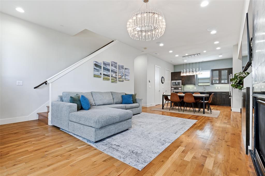 4618 Cedar Springs Road, Unit B Dallas, TX 75219 - Photo 9 of 24 a living room with furniture and a chandelier