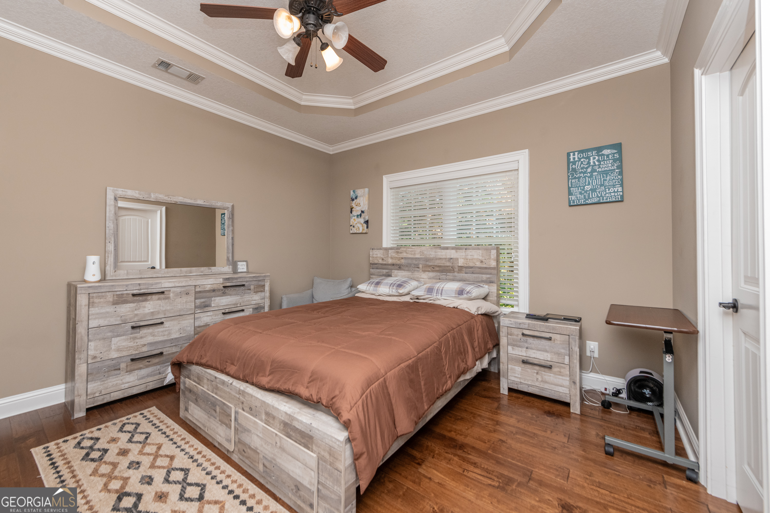 405 Old Bridge Road Warner Robins, GA 31088 - Photo 33 of 55 a bedroom with a bed and a chandelier