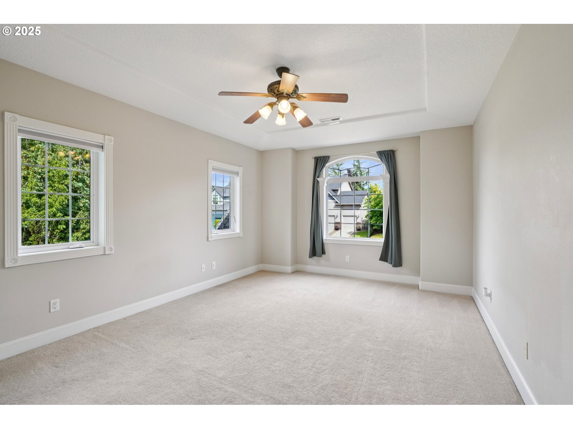 2144 Northwest 22nd Avenue Camas, WA 98607 - Photo 17 of 40 a view of an empty room with window chandelier fan