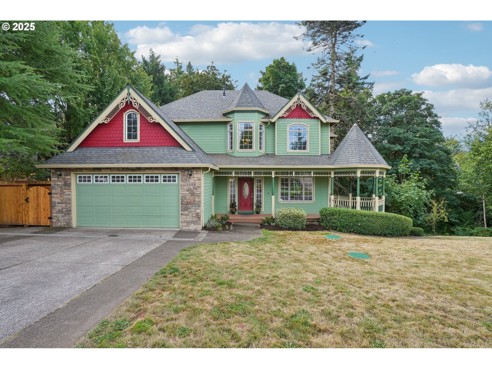 2144 Northwest 22nd Avenue Camas, WA 98607 - Photo 2 of 40 a front view of a house with a yard and garage