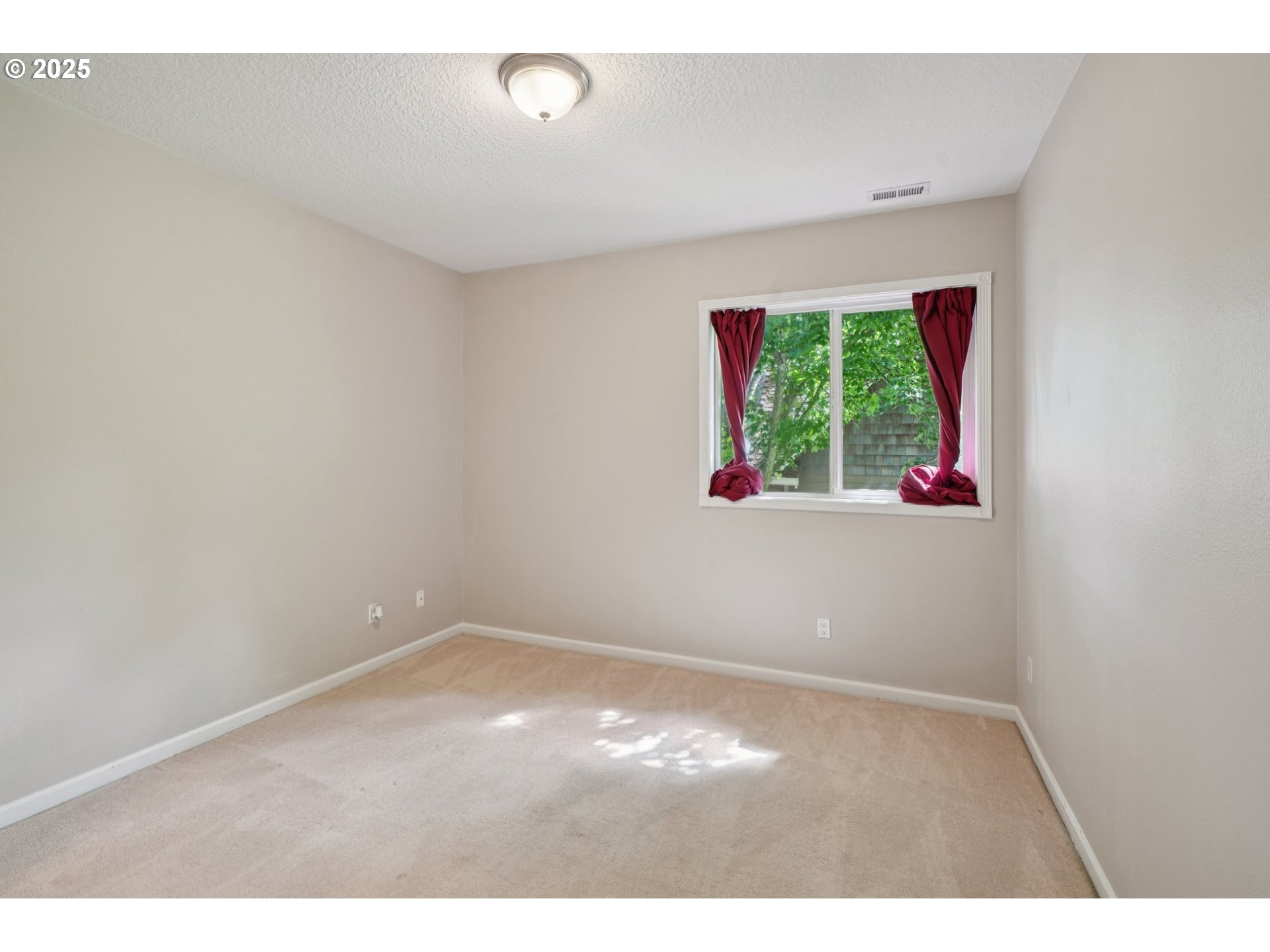 2144 Northwest 22nd Avenue Camas, WA 98607 - Photo 22 of 40 a view of an empty room with wooden floor and a window