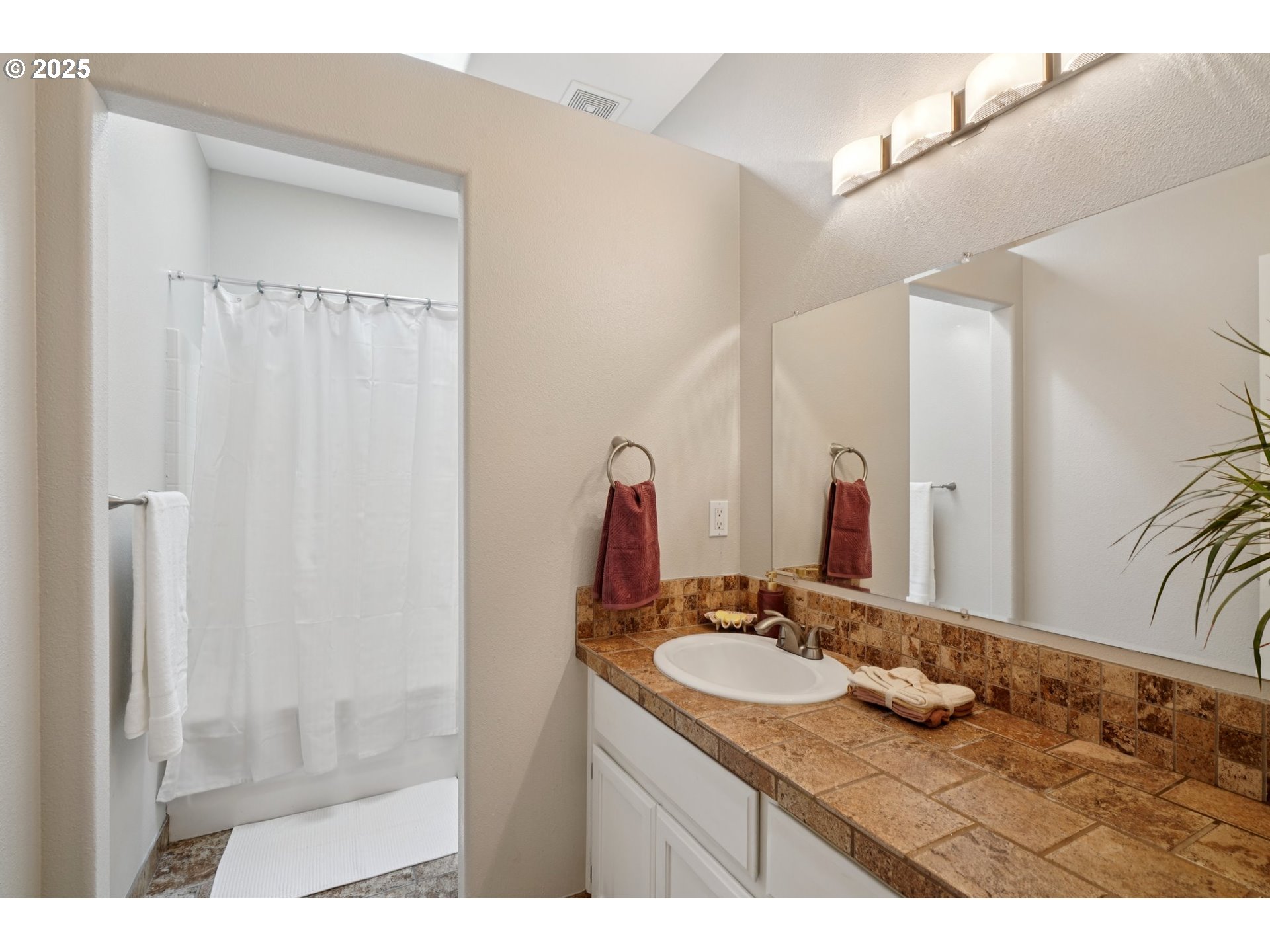 2144 Northwest 22nd Avenue Camas, WA 98607 - Photo 23 of 40 a bathroom with a granite countertop sink and a mirror