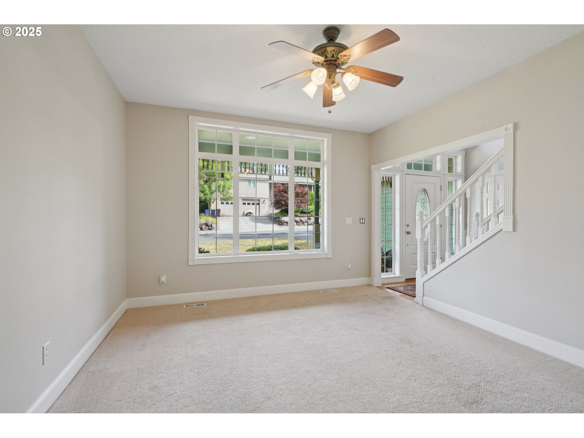 2144 Northwest 22nd Avenue Camas, WA 98607 - Photo 6 of 40 an empty room with windows and chandelier fan