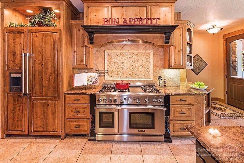 144 Sunstone Loop Bend, OR 97707 - Photo 7 of 24 Featuring granite countertops, tiered is