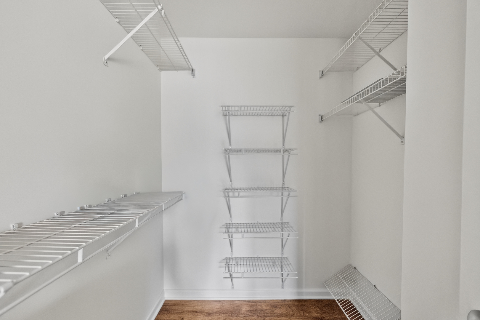 446 Cromwell Circle, Unit 4 Bartlett, IL 60103 - Photo 12 of 18 a view of walk in closet with empty racks