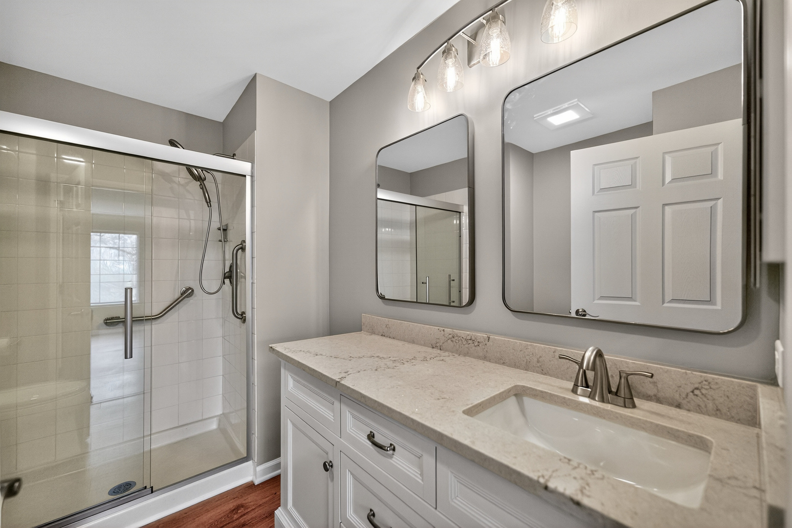 446 Cromwell Circle, Unit 4 Bartlett, IL 60103 - Photo 13 of 18 a bathroom with a granite countertop sink mirror and double