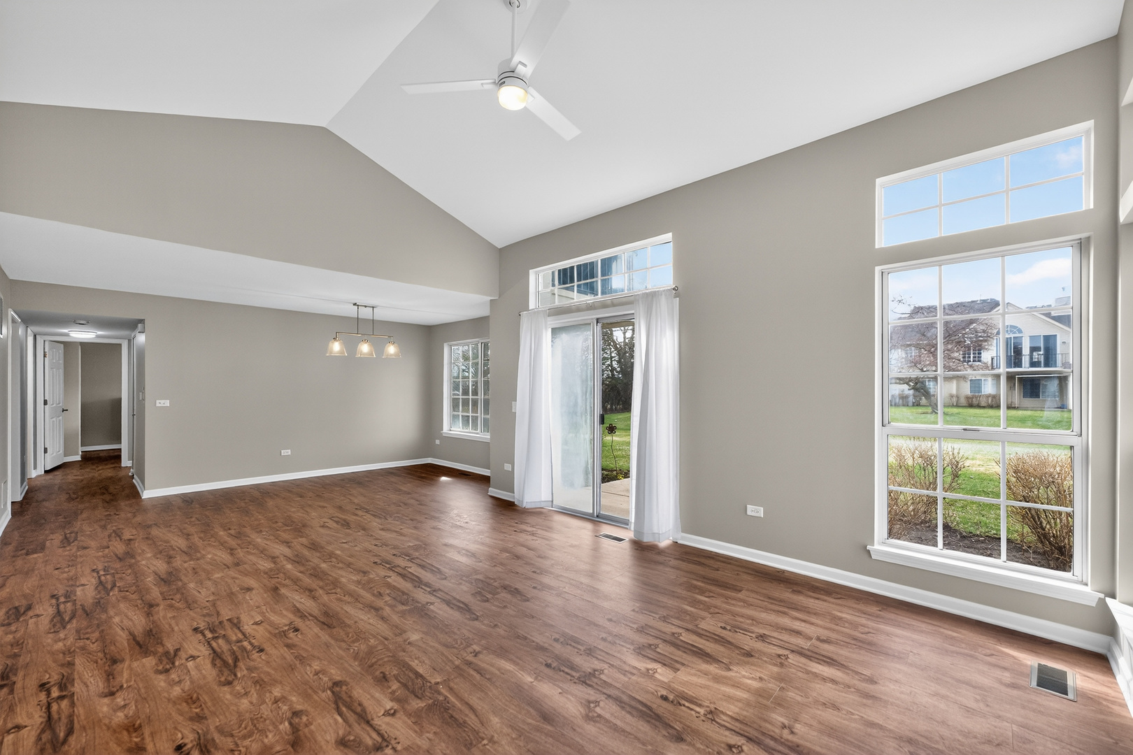446 Cromwell Circle, Unit 4 Bartlett, IL 60103 - Photo 3 of 18 wooden floor in an empty room with a window