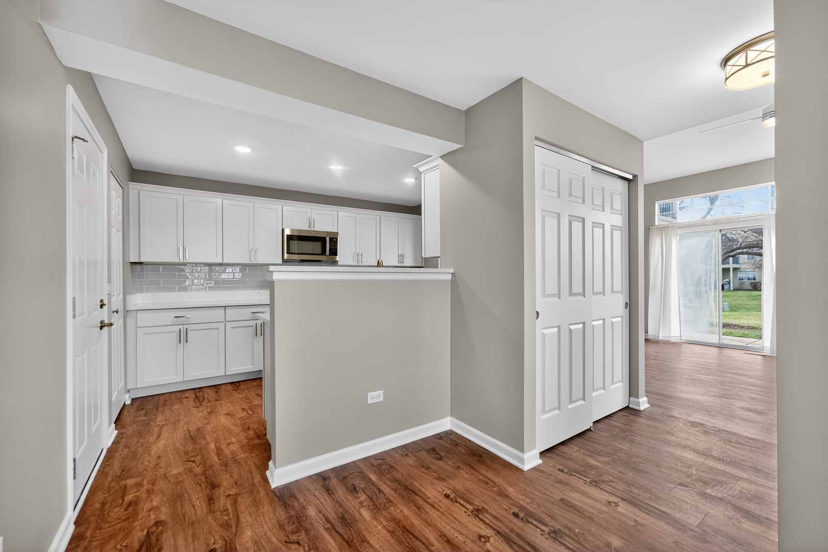 446 Cromwell Circle, Unit 4 Bartlett, IL 60103 - Photo 7 of 18 a view of a kitchen with wooden floor